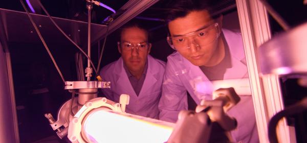 Dr. Lukas Graber (left) and Dr. Chanyeop Park (right) at work in a Georgia Power lab.