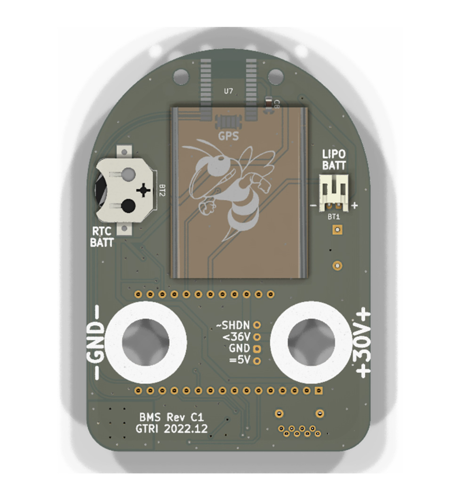 A flat circuit board rounded at the top and imprinted with the Georgia Tech yellow jacket logo, -GND-, +30V+, BMS Rev C1, GTRI 2022.12, RTC BATT, LIPO BATT, ~SHDN, <36V, GND, and =5V. 