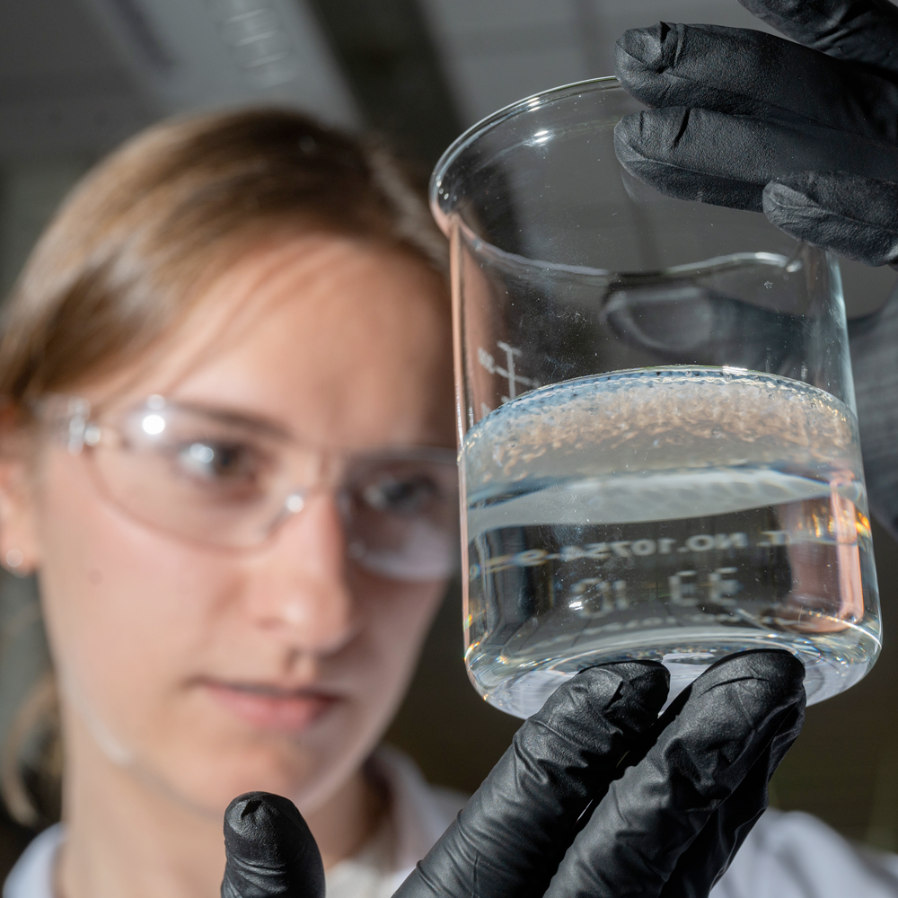 women looking into beaker